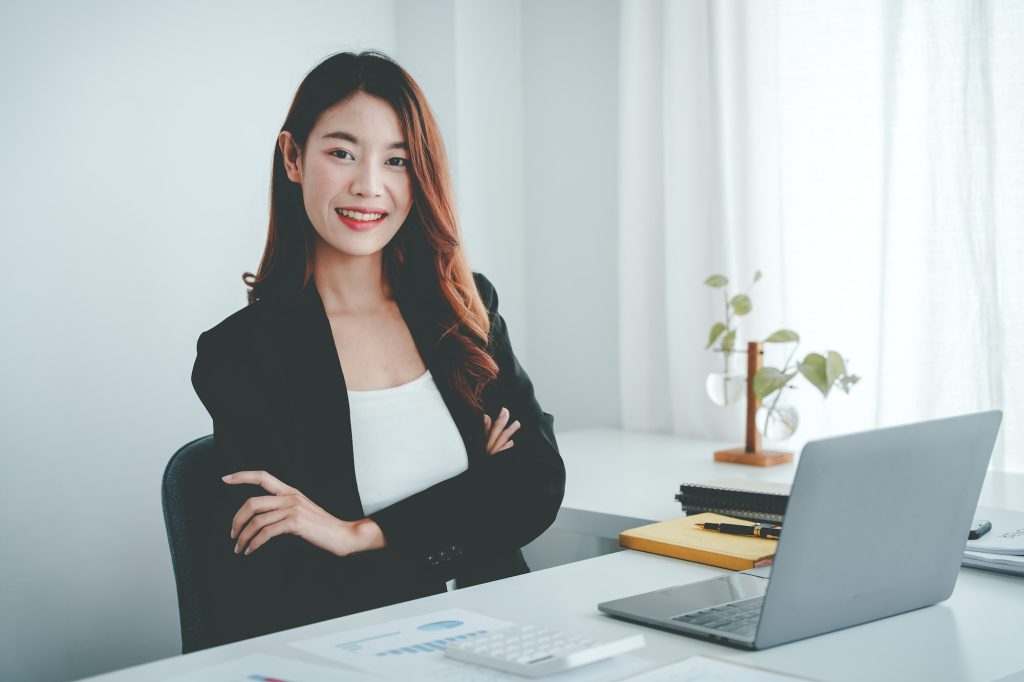 Asian woman working on customer documents, finance, accounting, taxes in the office.