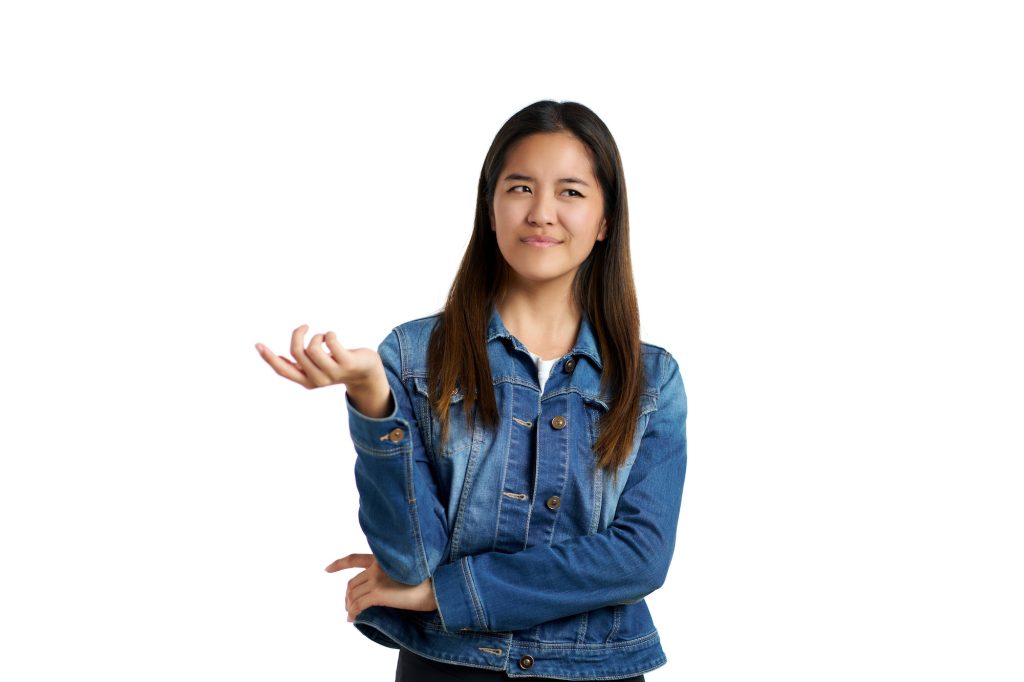 Portrait of an Asian woman with a gesture of asking what's going on