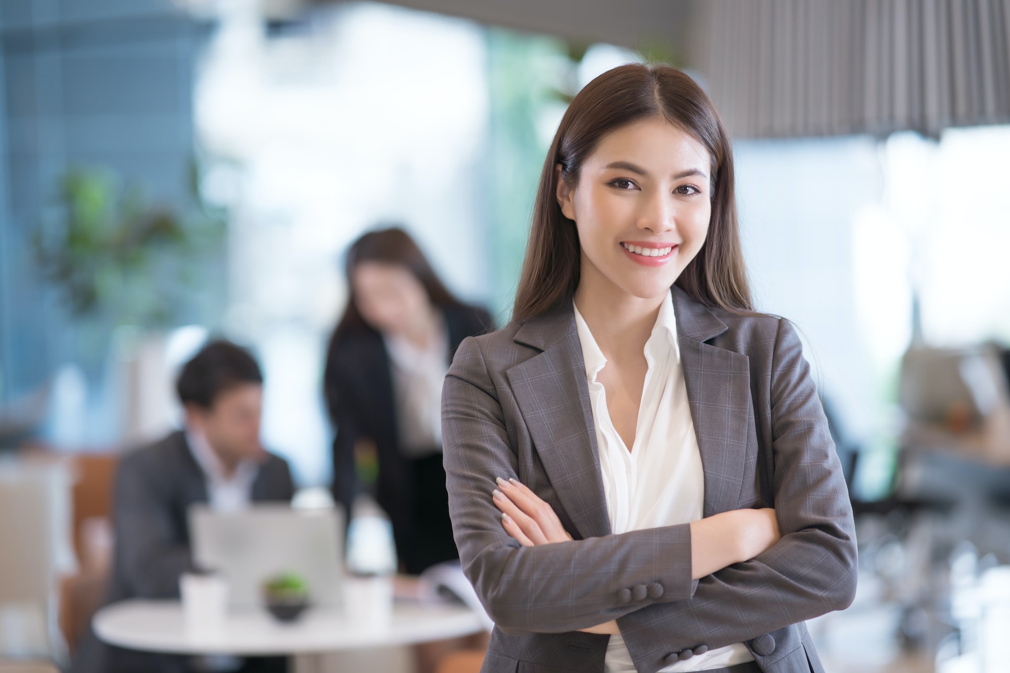 Portrait of successful young asian businesswoman at office